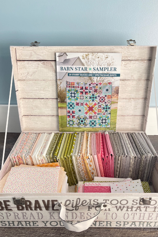fabrics and book for the Barn Star Sampler quilt along